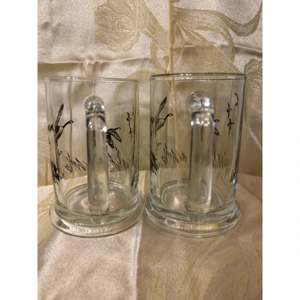 VTG AVON 1982 TANKARD MUGS STEIN CLEAR  GLASS WITH FLYING DUCKS/GEESE  Set Of 2